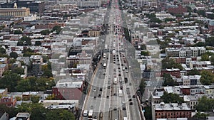 Aerial view of a freeway cutting through Brooklyn