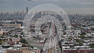 Aerial view of a freeway cutting through Brooklyn
