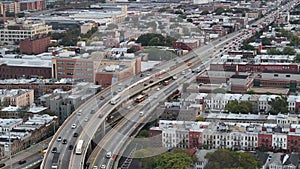 Aerial view of a freeway cutting through Brooklyn