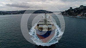 Aerial view of freight ship with cargo containers.