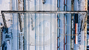 Aerial view of freight train yard covered in snow