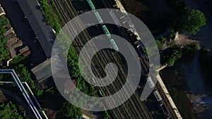 Aerial view freight trains on railway industrial factory. Cargo trains top view