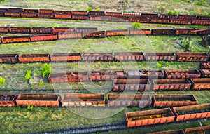 Aerial view of freight trains. Top view of old rusty wagons