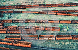 Aerial view of freight trains. Top view of old rusty wagons