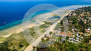 Aerial view of the fringing coral reef surrounding the small island of Gili Air in Lombok, Indonesia