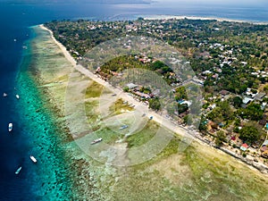 Aerial view of a fringing tropical coral reef around the coastline of a tiny island in Indonesia (Gili Air