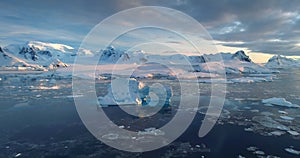 Aerial view of frozen Antarctica iceberg arch