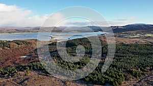 Aerial view of a frozen Bonny Glen Woods by Portnoo in County Donegal, Ireland.