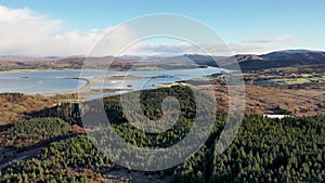 Aerial view of a frozen Bonny Glen Woods by Portnoo in County Donegal, Ireland.