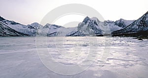 Aerial view of frozen lake in a beautiful winter landscape in Norway