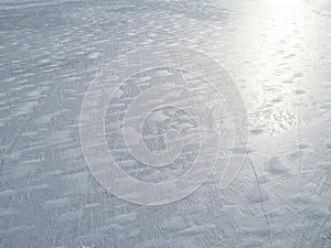 Aerial view of a frozen lake surface. Aerial Snow pattern on the frozen lake. Frozen lake ice captured with a drone. Aerial photo