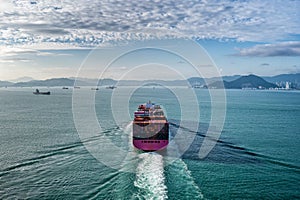 Aerial view of fully loaded container ship  arriving