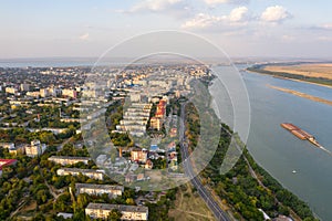 Aerial view of Galati City, Romania. Danube River near city with sunset warm light