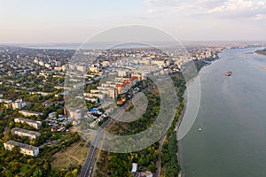 Aerial view of Galati City, Romania. Danube River near city with sunset warm light