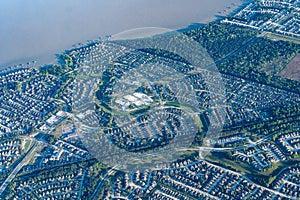 Aerial view of gated communities and a fishing pier on Lake Houston