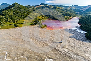 Aerial view of Geamana village toxic waste lake from coper mine