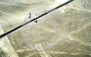 Aerial view of geoglyph lines in Nazca desert - Travel concept with exclusive destination in Peru - Nature wonder in south america