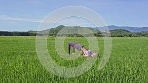 Aerial View Girl Doing Yoga in Open Air by Green Hills