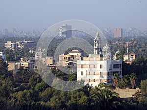 Aerial view of Giza Egypt with fields at the country side and modern buildings and crowded houses