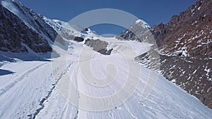 Aerial view of a glacier huge pieces of frozen ice and rock, top view. The glacier melts, the problems of ecology and