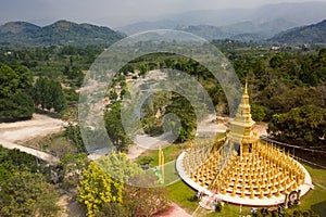 Aerial view of gold buddist pagoda in saraburi central of thailand