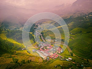 Aerial view of golden rice terraces at Mu cang chai town near Sapa city, north of Vietnam. Beautiful terraced rice field in