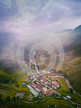 Aerial view of golden rice terraces at Mu cang chai town near Sapa city, north of Vietnam. Beautiful terraced rice field in