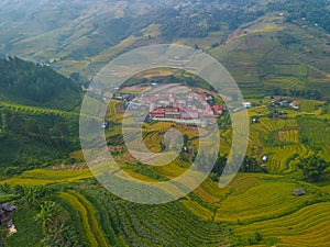 Aerial view of golden rice terraces at Mu cang chai town near Sapa city, north of Vietnam. Beautiful terraced rice field in