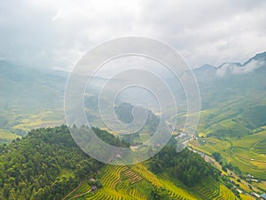 Aerial view of golden rice terraces at Mu cang chai town near Sapa city, north of Vietnam. Beautiful terraced rice field in