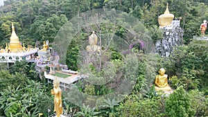 Aerial view of golden rock pagoda of Phra That In Kwaen temple in Phrae, Thailand. Kyaiktiyo Pagoda in Phrae