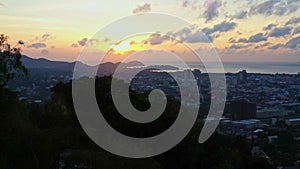 aerial view golden sky at sunrise above the beautiful tower on Khao Rang hill.