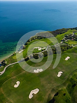 Aerial View of Golf Course Adjacent to Sea