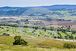 Aerial view of golf course and agricultural fields, mountain background, south San Francisco bay, San Jose, California