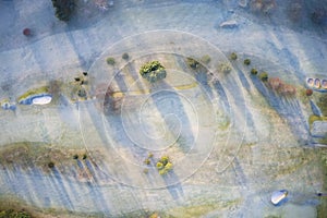 Aerial view of golf course green from above frozen grass in winter at Banchory Aberdeenshire Scotland