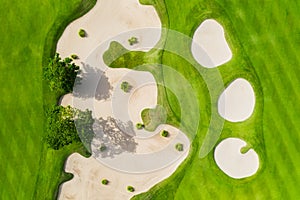 Aerial view on the golf course. Green grass on the athletic field. Sports and competition.