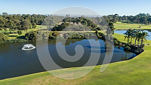 Aerial view of golf course water hazard dam