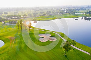 Aerial view of golf field landscape with sunrise view in the morning shot