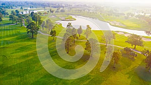 Aerial view of golf field landscape with sunrise view in the morning shot