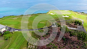 Aerial view of golf field next the clif and ocean