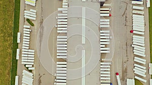 Aerial view. goods distribution warehouse. Semi trucks loading cargo containers. Logistics export and import cargo distribution