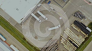 Aerial view. goods distribution warehouse. Semi trucks loading cargo containers. Logistics export and import cargo distribution