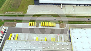 Aerial view. goods distribution warehouse. Semi trucks loading cargo containers. Logistics export and import cargo distribution