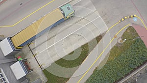 Aerial view. goods distribution warehouse. Semi trucks loading cargo containers. Logistics export and import cargo distribution