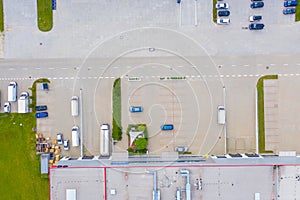 Aerial view of goods warehouse. Logistics center in industrial city zone from drone view. Background texture concept