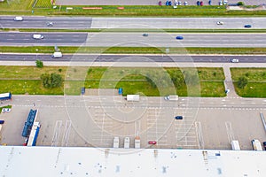 Aerial view of goods warehouse. Logistics center in industrial city zone from drone view. Background texture concept