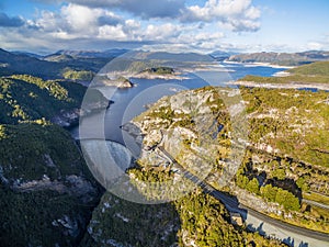 Aerial view of Gordon Dam and lake at sunset. Southwest, Tasmania