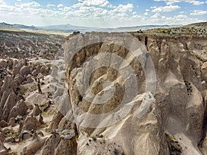 Aerial view of Goreme National Park, Goreme Tarihi Milli Parki, Turkey. The typical rock formations of Cappadocia photo