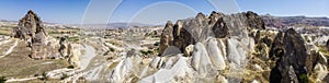 Aerial view of Goreme National Park, Tarihi Milli Parki, Turkey. The typical rock formations of Cappadocia. Tourists on quads