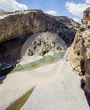 Aerial view of the gorge with prehistoric caves over the the wide and almost dry river bed of Cendere. Nemtur Dagi road. Turkey