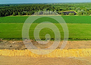 Aerial view Gravel quarrying from the air in a gravel pit